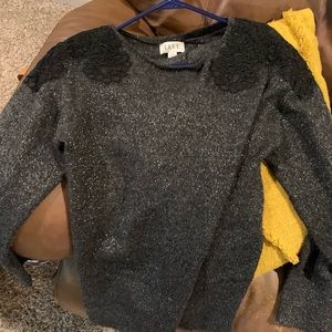 Elle Black shimmer sweater with lace designs on shoulders